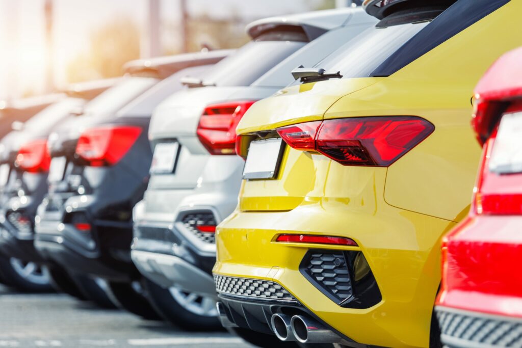 A fleet of modern multi-coloured SUVs at a dealership, illustrating the fast-changing French car market.