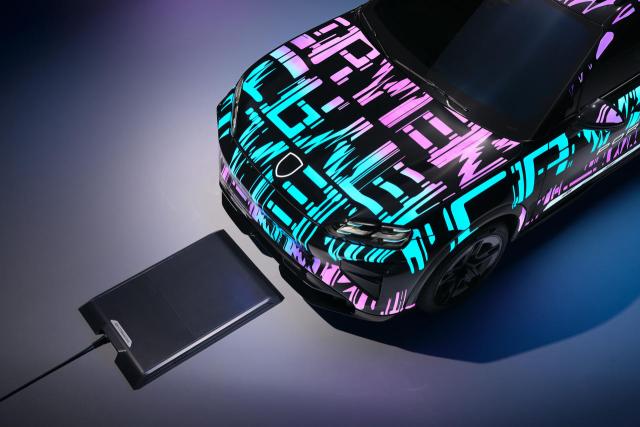 Induction charging plate for the electric Porsche Cayenne, a floor-mounted device for cable-free charging of the premium SUV.