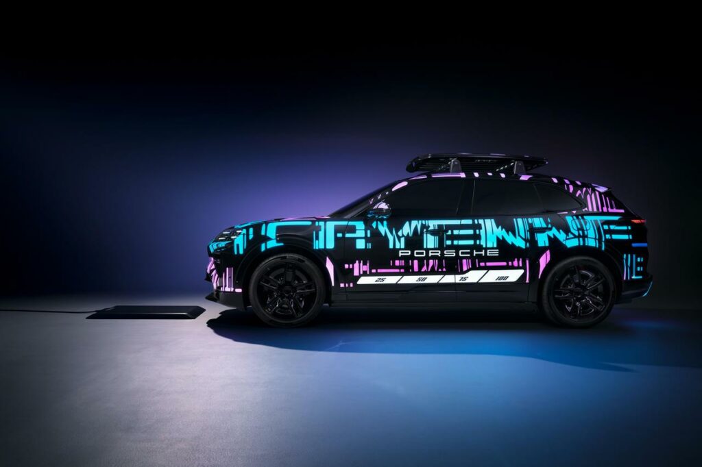Porsche Cayenne electric 2026 seen in profile, camouflaged prototype at the Munich Motor Show with innovative induction charging