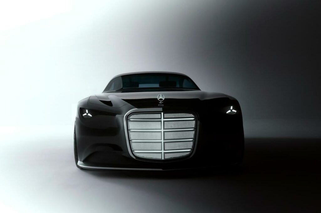 Front of the Mercedes-Benz Vision Iconic with illuminated radiator grille and illuminated star