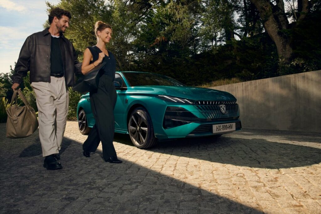Peugeot E-308 electric front view on urban road