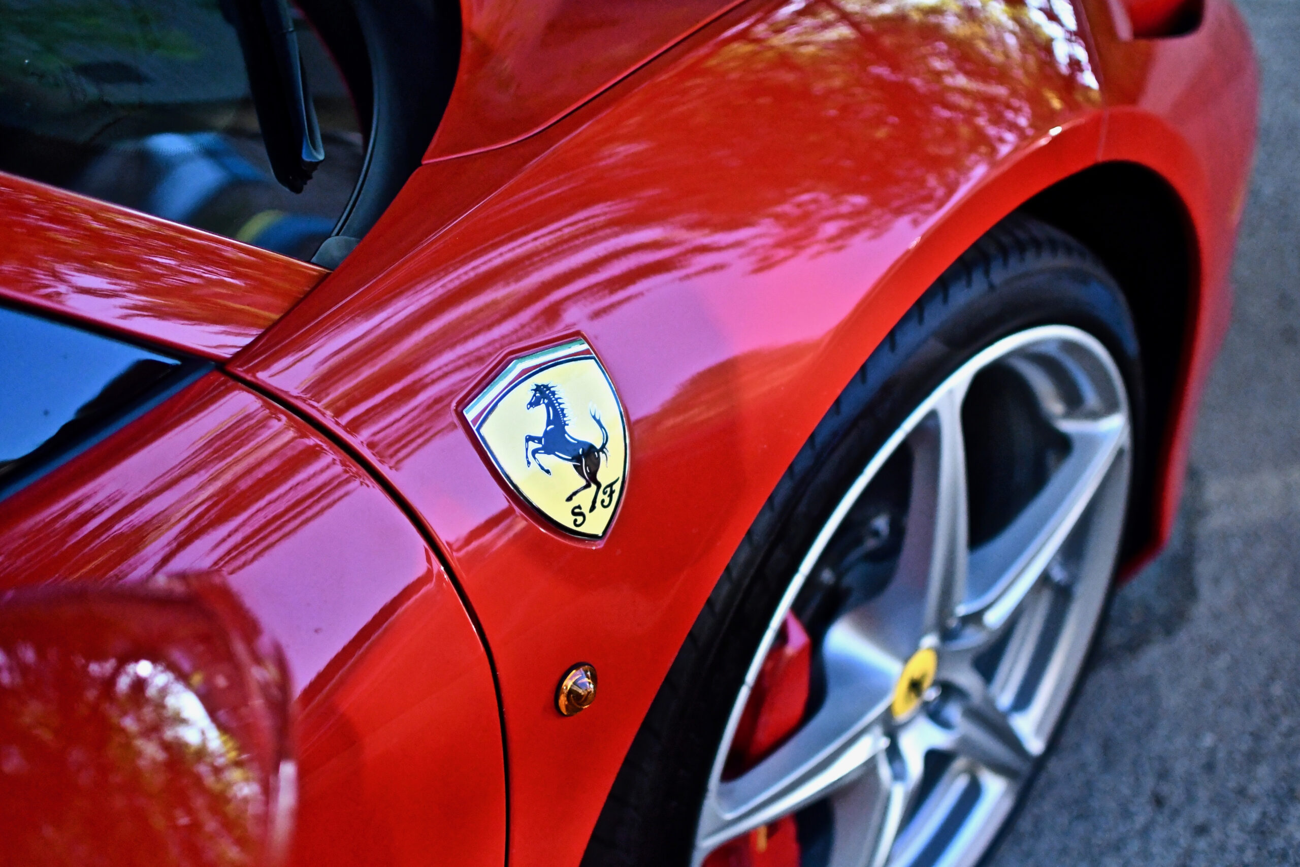 Zoom in on the Ferrari Elettrica logo on the bodywork, a symbol of Italian performance and prestige.