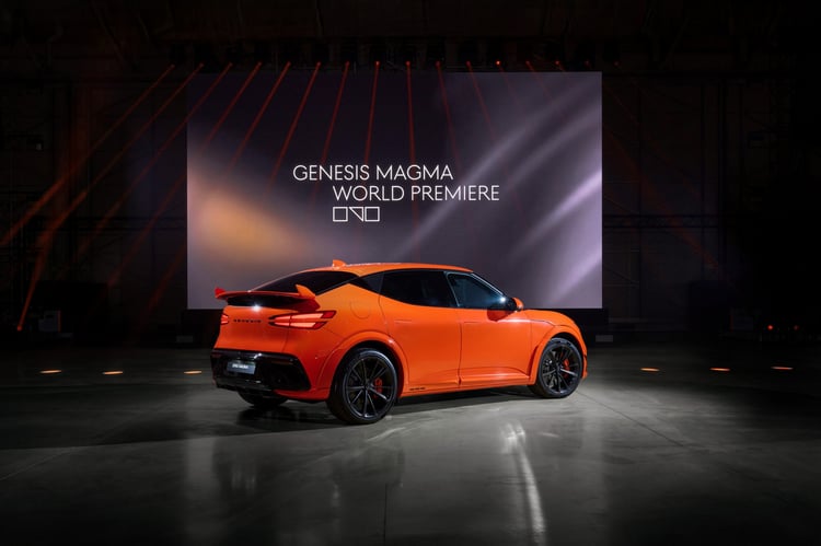 Genesis GV60 Magma rear view and profile, electric SUV with functional spoiler and rear diffuser