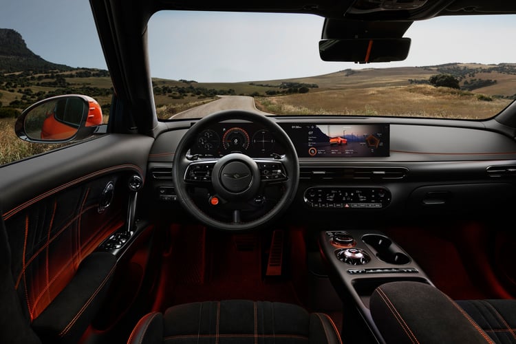 Genesis GV60 Magma driver's cabin, steering wheel and dashboard with orange stitching