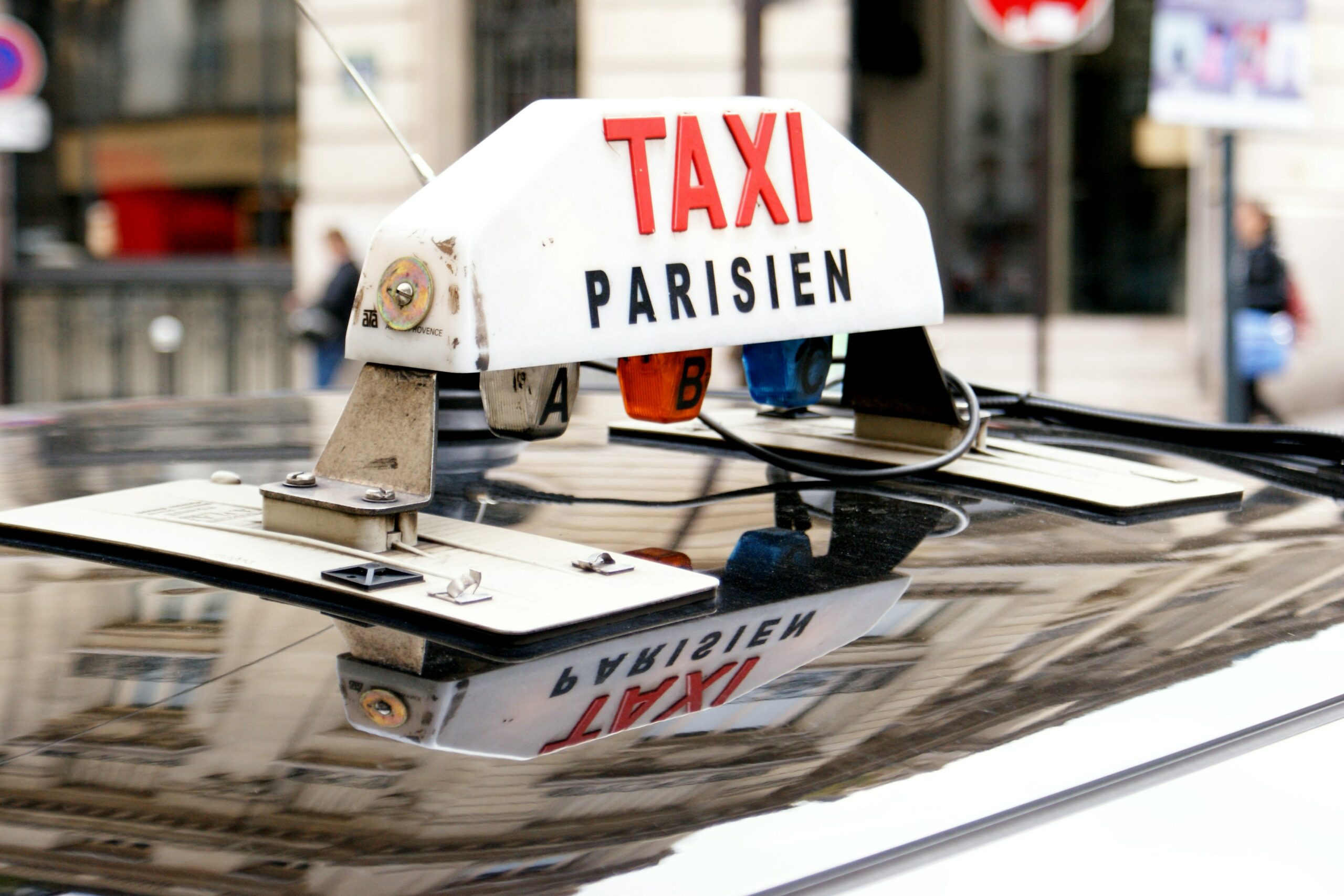 Electric Parisian taxi - illuminated sign on the roof of a vehicle