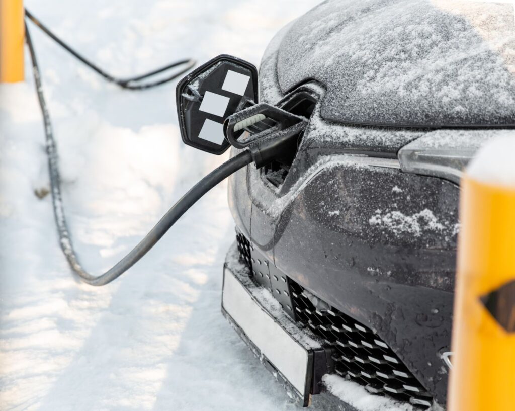 Close-up of a snow-covered electric recharging point